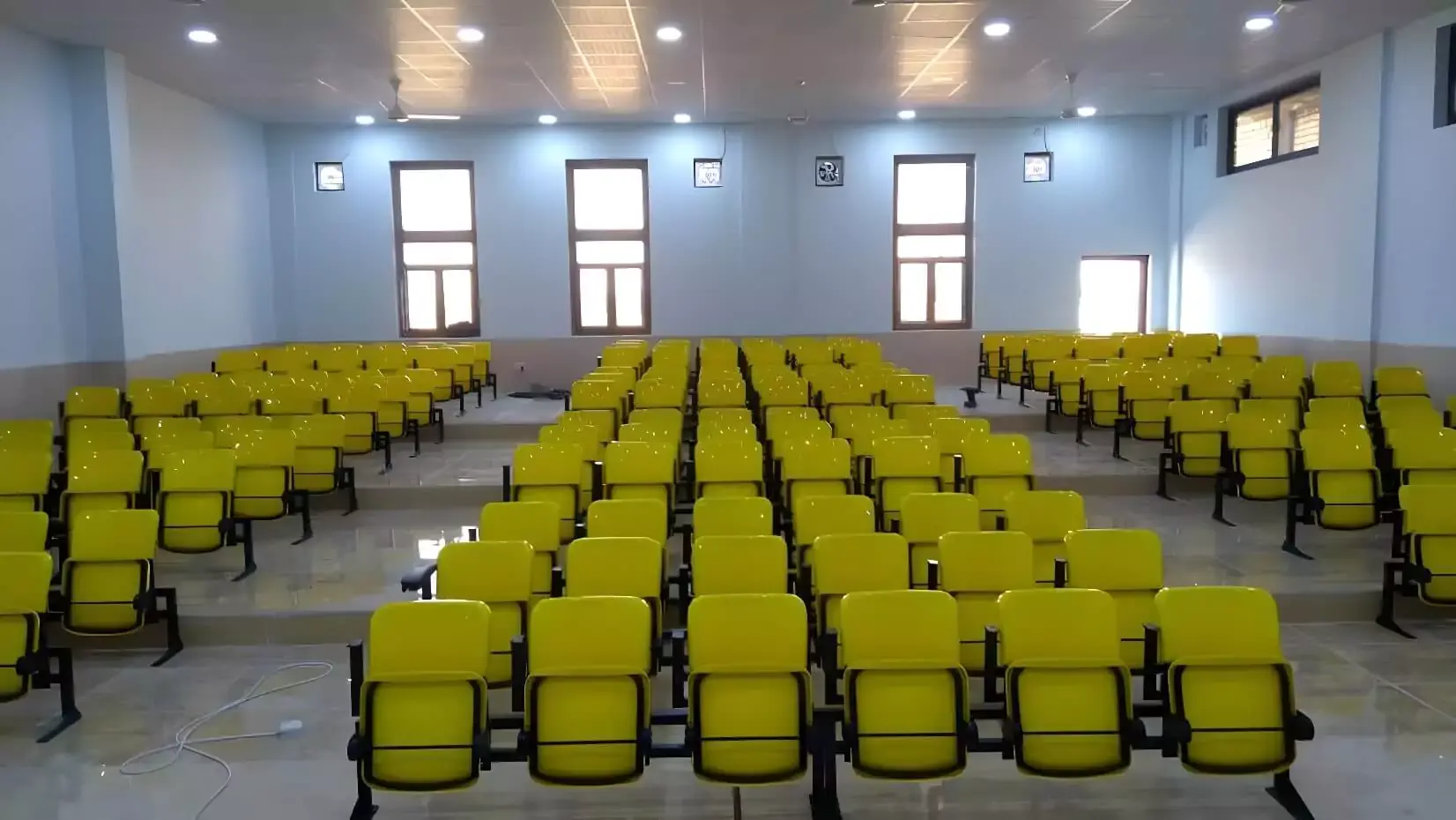Outdoor stadium seating project with UV-stabilized polymer seats, engineered for color retention and structural performance under continuous sun exposure. Image